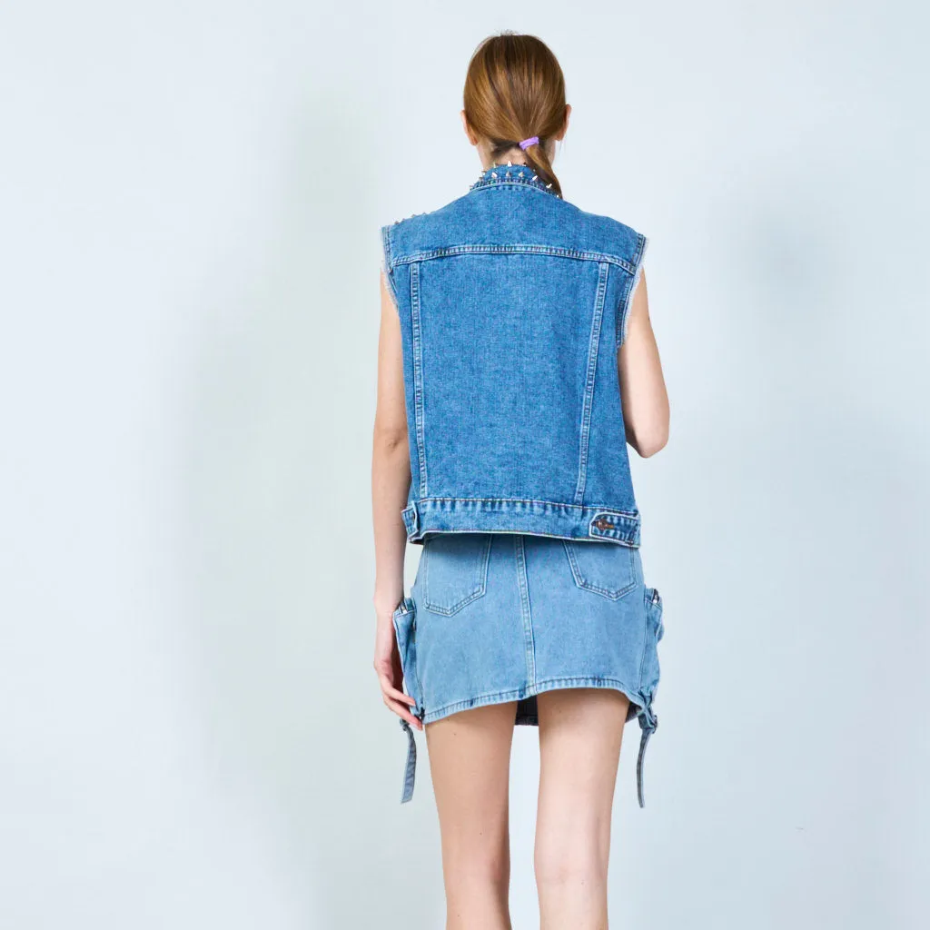 Distressed sleeveless denim jacket with stud embellishments wholesale